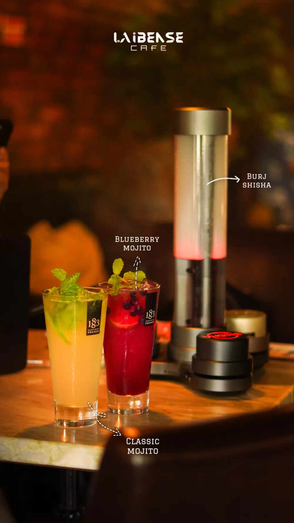 Classic and blueberry mojitos beside the Burj Shisha with hand drawn labels
