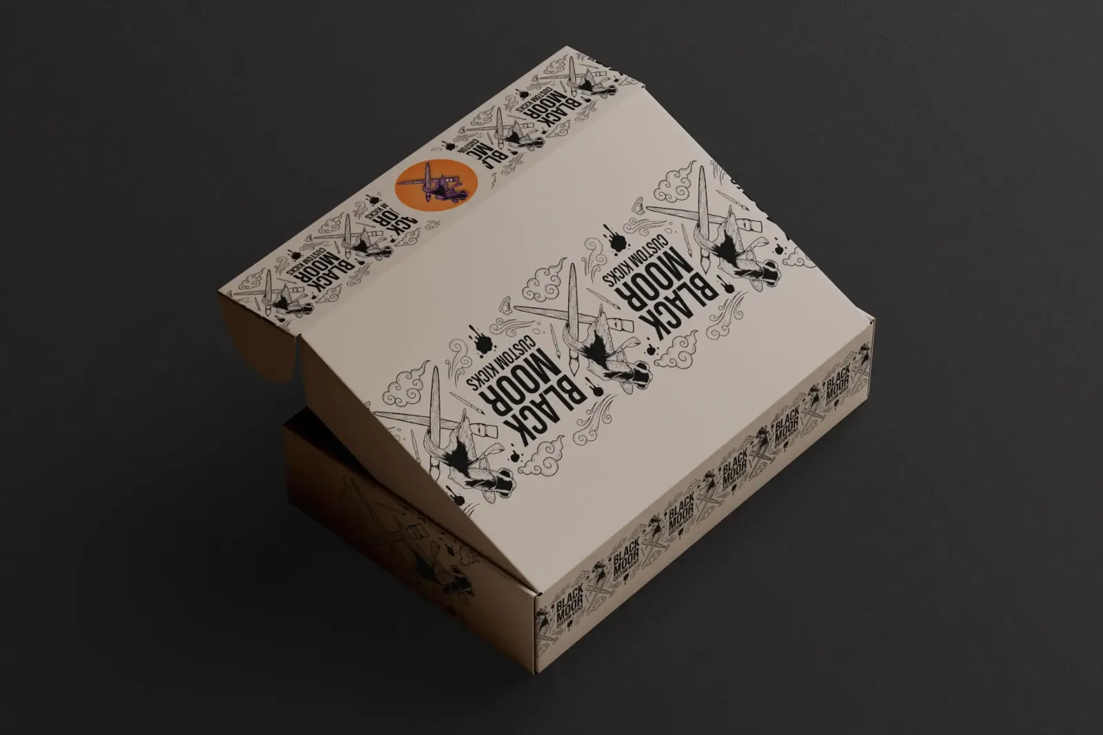 Black Moor brand box with the lid partly open showing the orange logo sticker