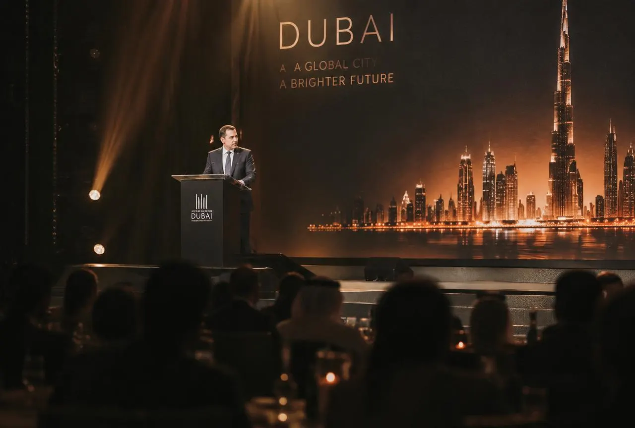 Speaker at a podium on stage at a Dubai corporate gala